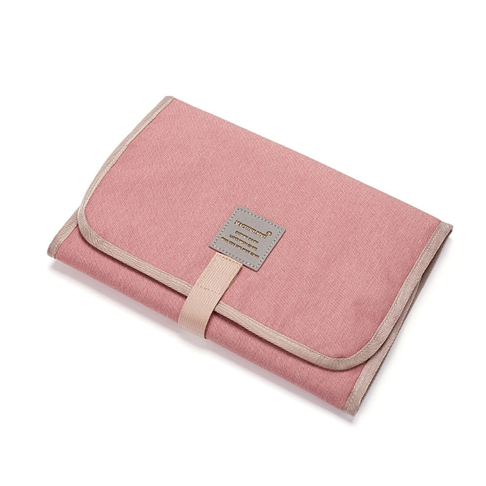 Tapis à langer nomade rose
