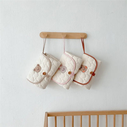 Tapis à Langer Bébé Pochette Pliable Motifs Animaux | Doucino™